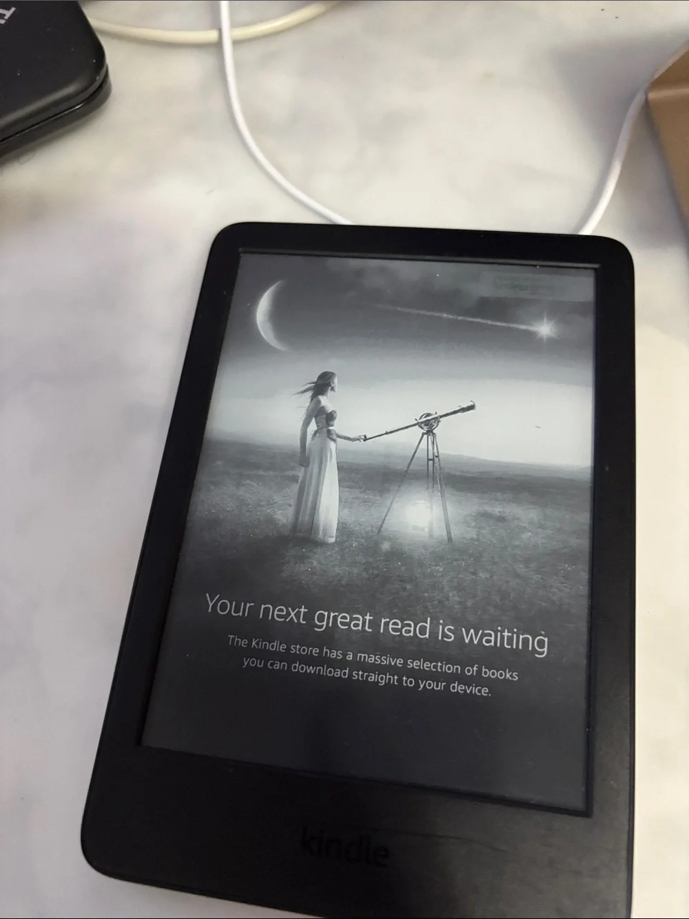 Amazon Kindle Gen 11 16GB E-Reader in Black with a clear case